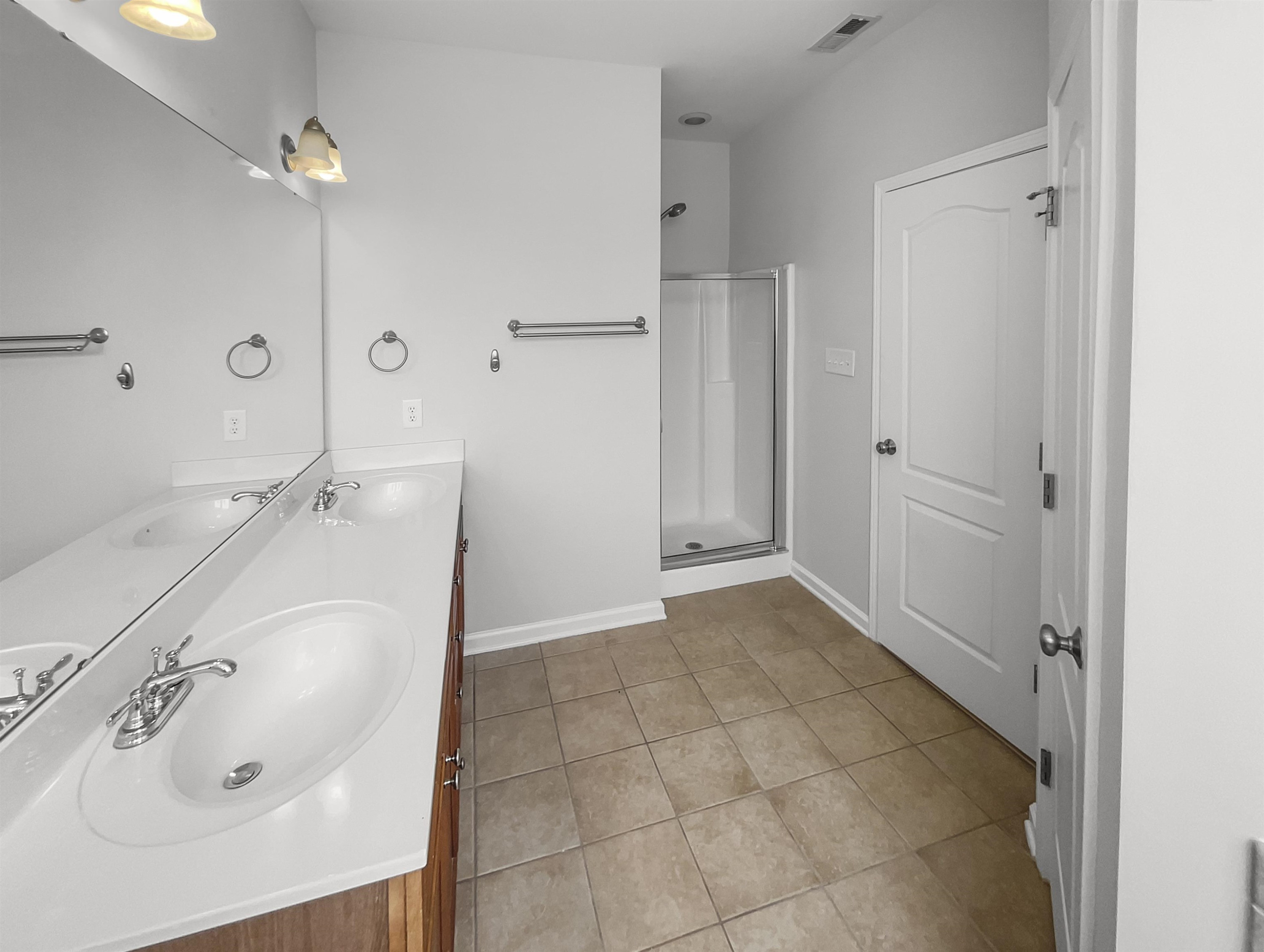 3154 Groveshire Drive Raleigh, NC 27616 - Photo 11 of 20 a bathroom with a sink and a mirror