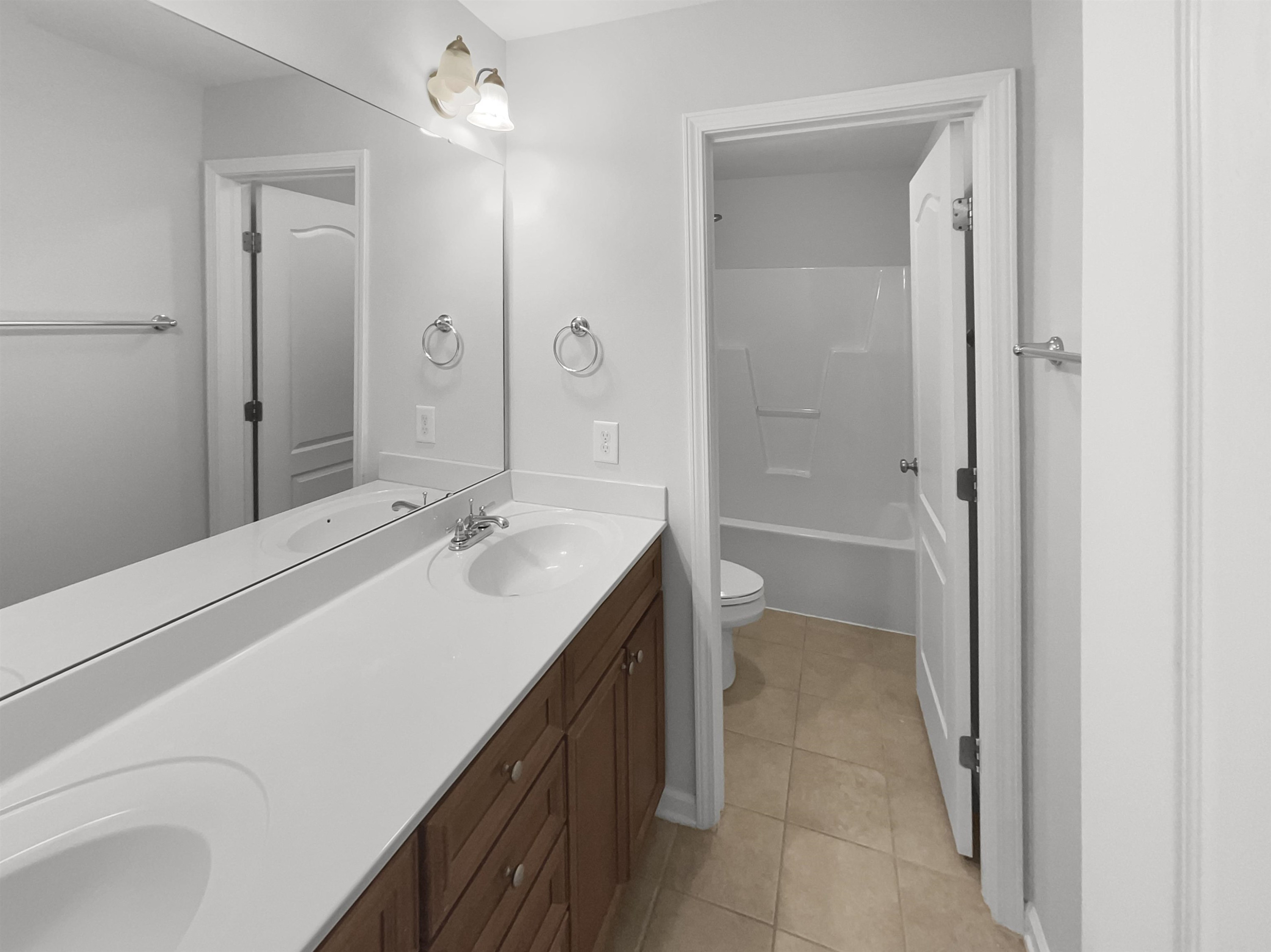 3154 Groveshire Drive Raleigh, NC 27616 - Photo 16 of 20 a bathroom with a sink a toilet and shower