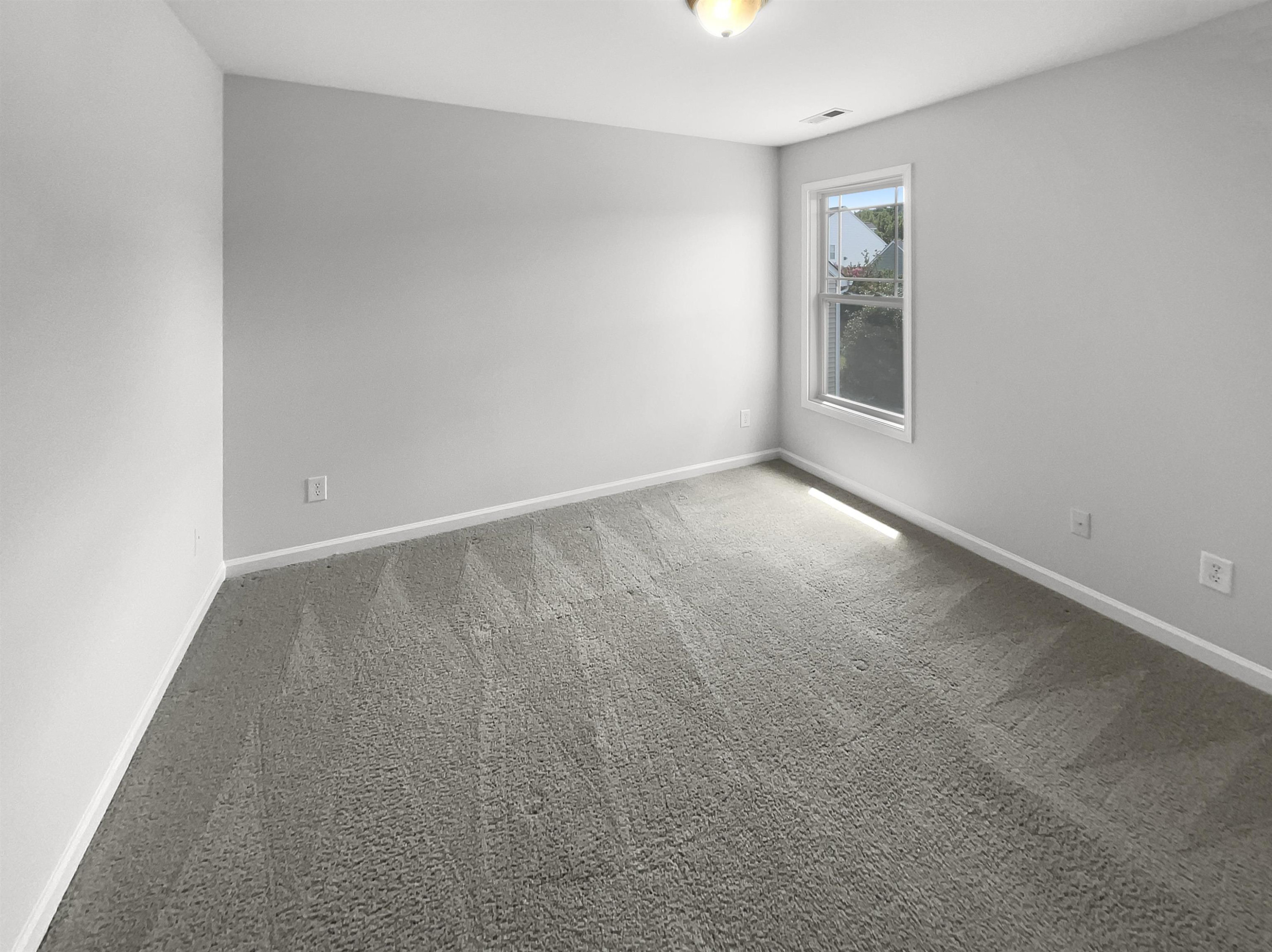 3154 Groveshire Drive Raleigh, NC 27616 - Photo 17 of 20 an empty room with windows