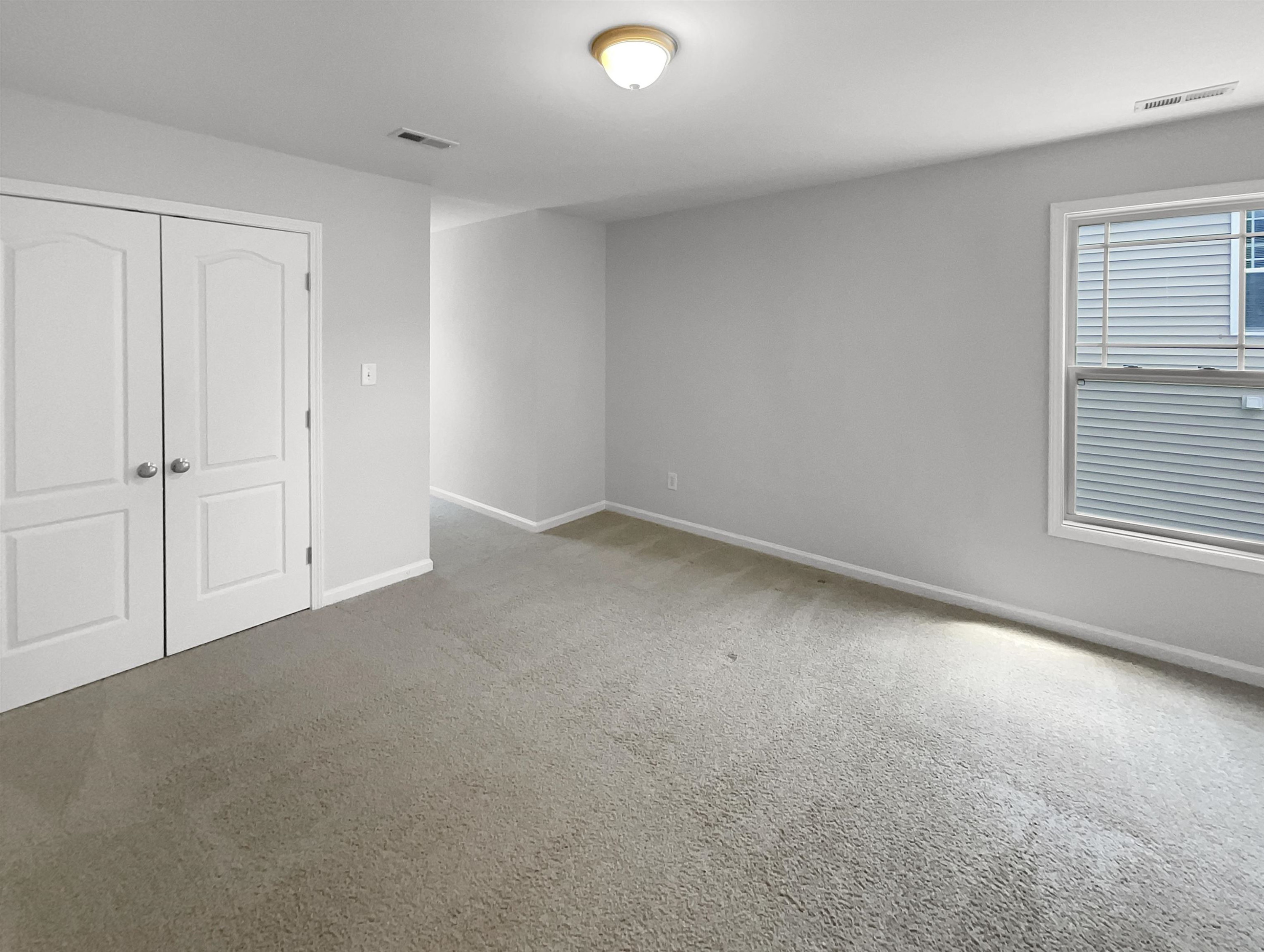 3154 Groveshire Drive Raleigh, NC 27616 - Photo 18 of 20 a view of an empty room and window