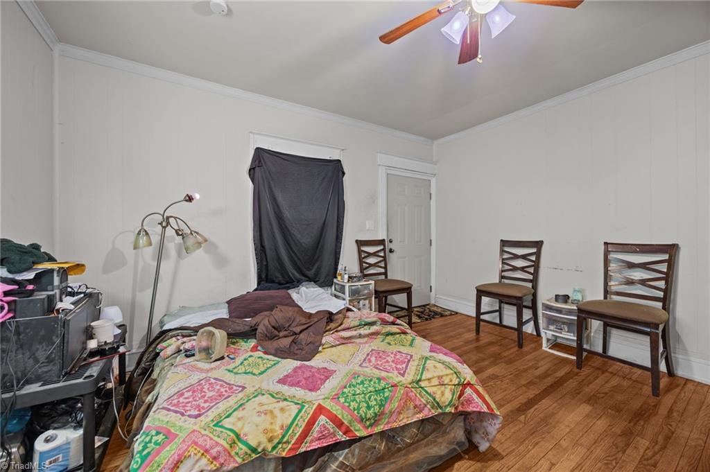 112 Briggs Place, Unit A & B High Point, NC 27262 - Photo 4 of 33 Primary bedroom with fireplace and ceiling fan-Unit A.