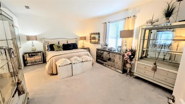 a bedroom with bed and large window