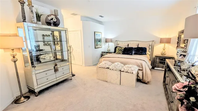 a bedroom with a bed and dresser