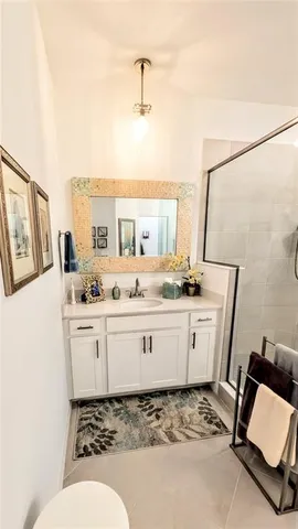 a bathroom with a sink toilet and mirror