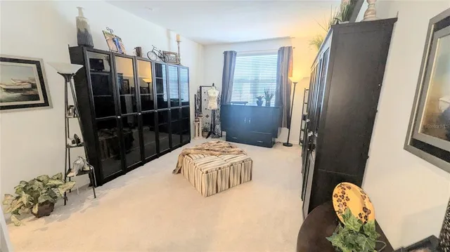 a bedroom with a bed and a mirror