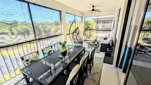 a view of deck with furniture and a window