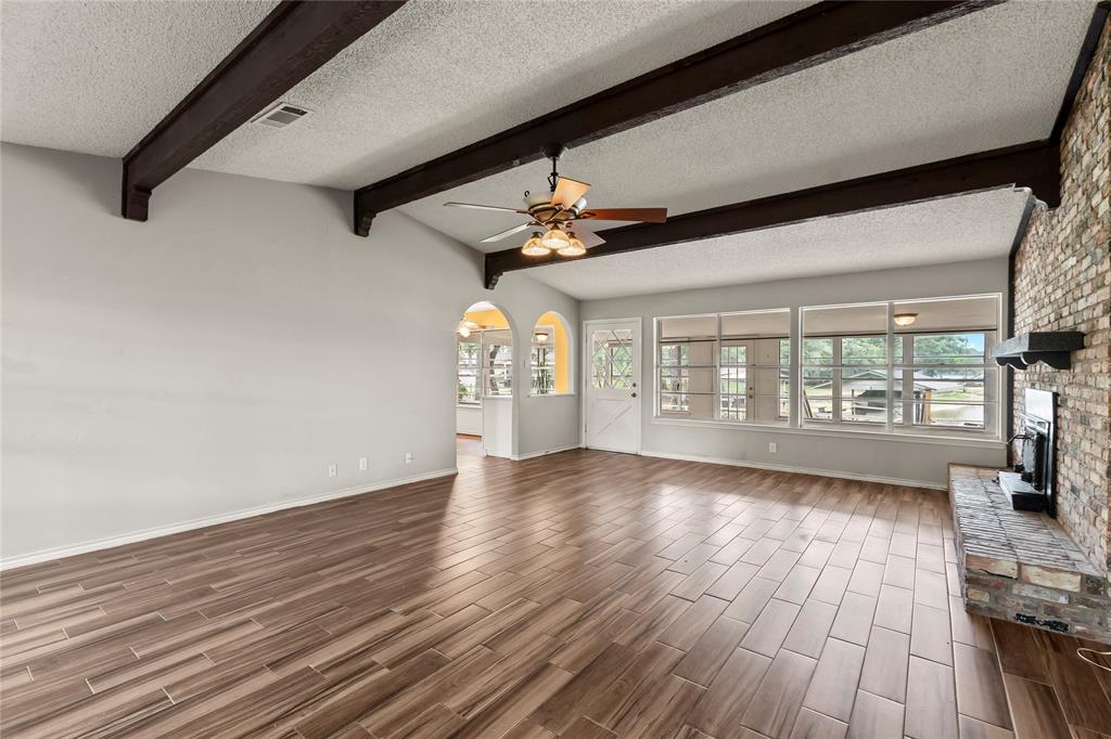 111 Deer Island Road Mabank, TX 75156 - Photo 10 of 26 Living room, with access to a sunroom.