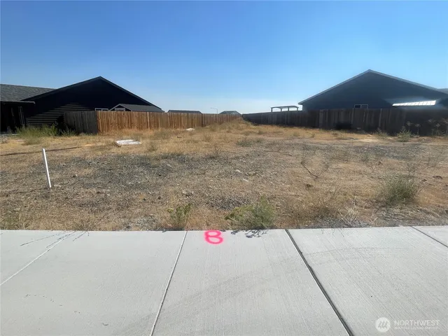 a view of wooden fence and a mountain view in back