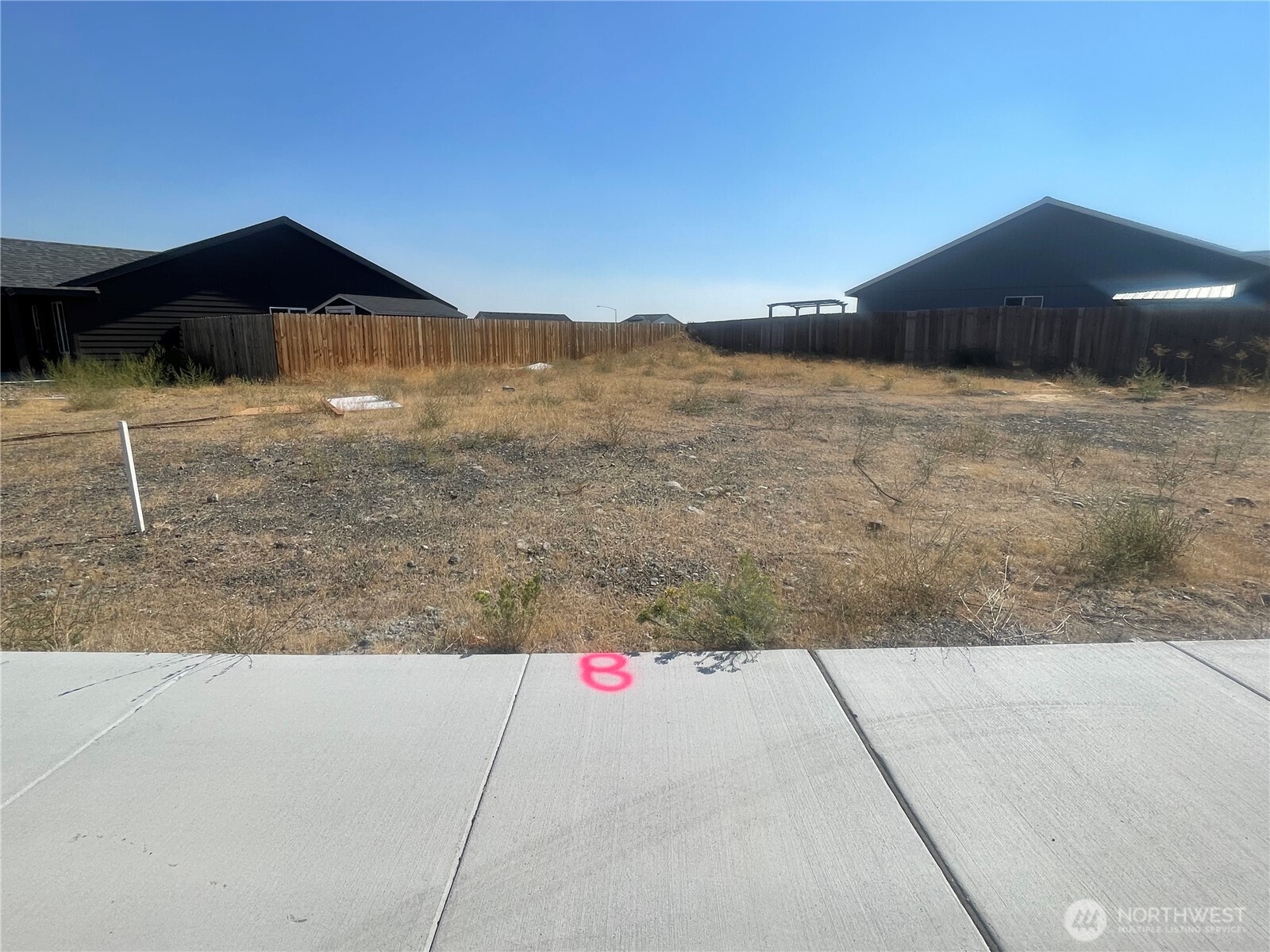 28 Parkside Loop Southeast Ephrata, WA 98823 - Photo 1 of 1 a view of wooden fence and a mountain view in back