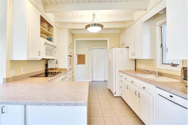 8 Plummer Road Boxford, MA 01921 - Photo 11 of 27 a large white kitchen with a sink and dishwasher