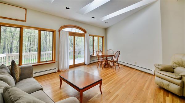 8 Plummer Road Boxford, MA 01921 - Photo 15 of 27 a living room with furniture and a large window