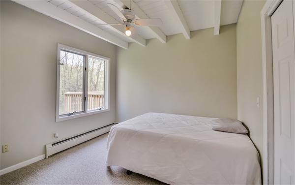 8 Plummer Road Boxford, MA 01921 - Photo 22 of 27 a bed sitting in a bedroom next to a window