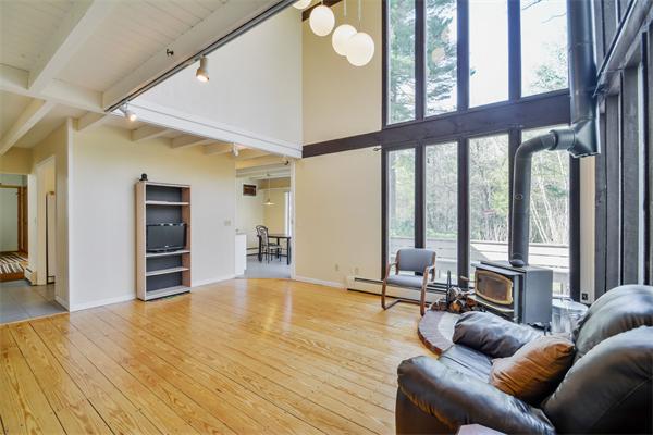 8 Plummer Road Boxford, MA 01921 - Photo 6 of 27 a living room with furniture and large windows