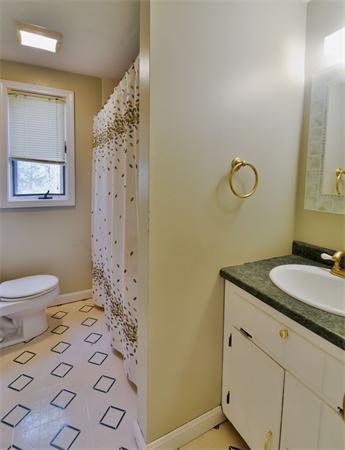 8 Plummer Road Boxford, MA 01921 - Photo 10 of 27 a bathroom with a granite countertop sink a toilet and a shower