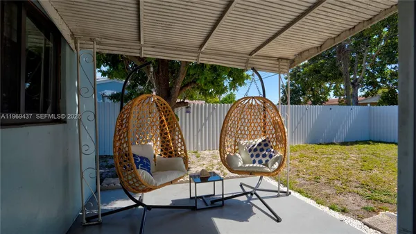 a view of a swimming pool with sitting area