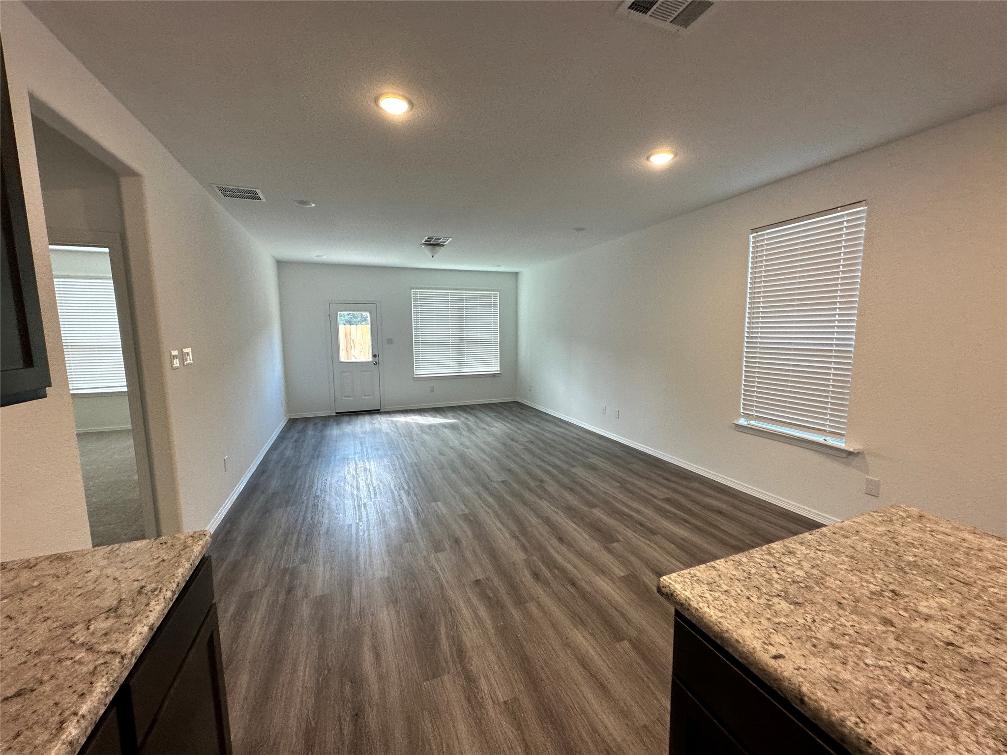 16572 Moss Lane Porter, TX 77365 - Photo 4 of 17 a view of kitchen and hallway with wooden floor
