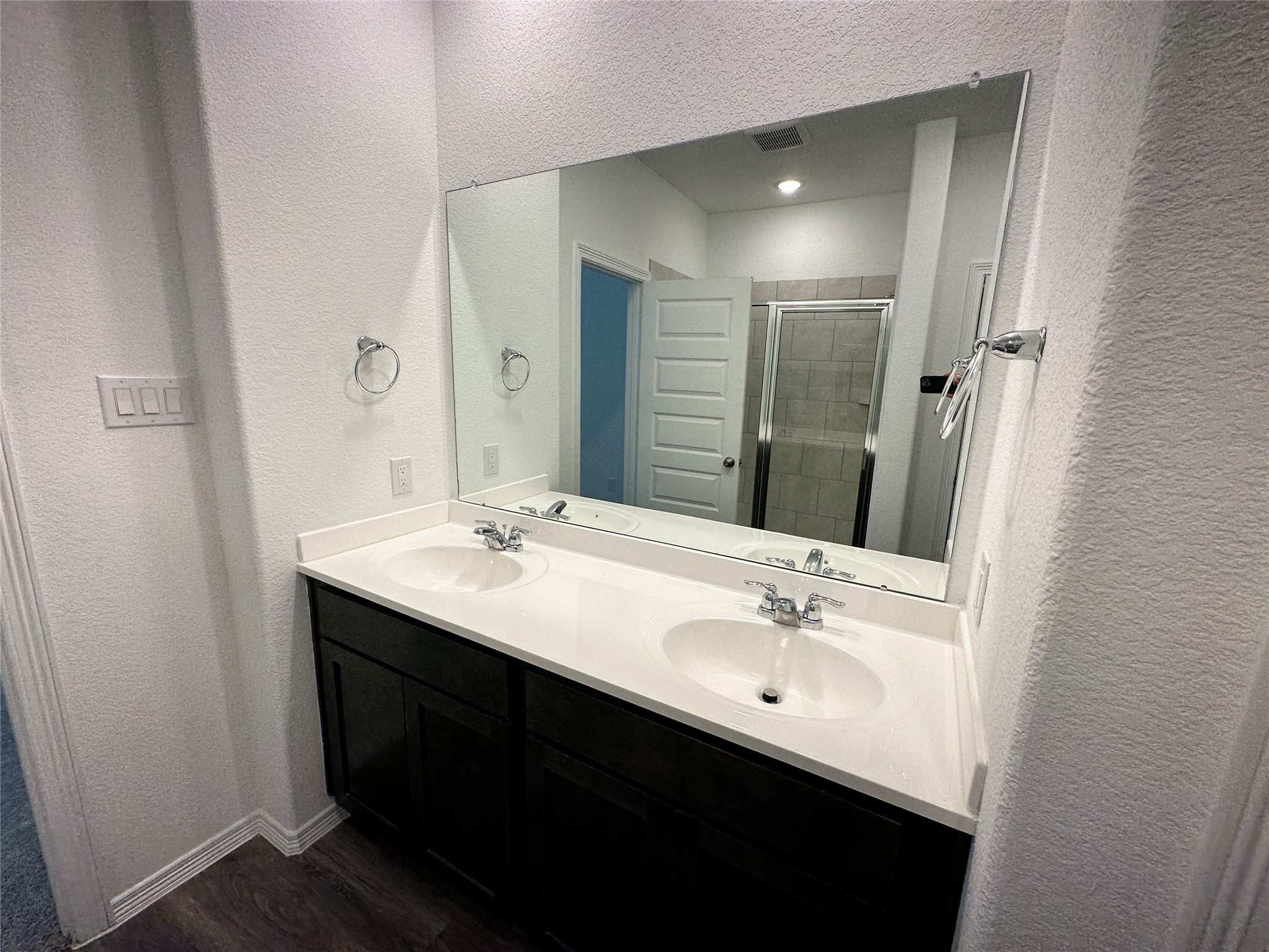 16572 Moss Lane Porter, TX 77365 - Photo 6 of 17 a bathroom with a double vanity sink a and a mirror