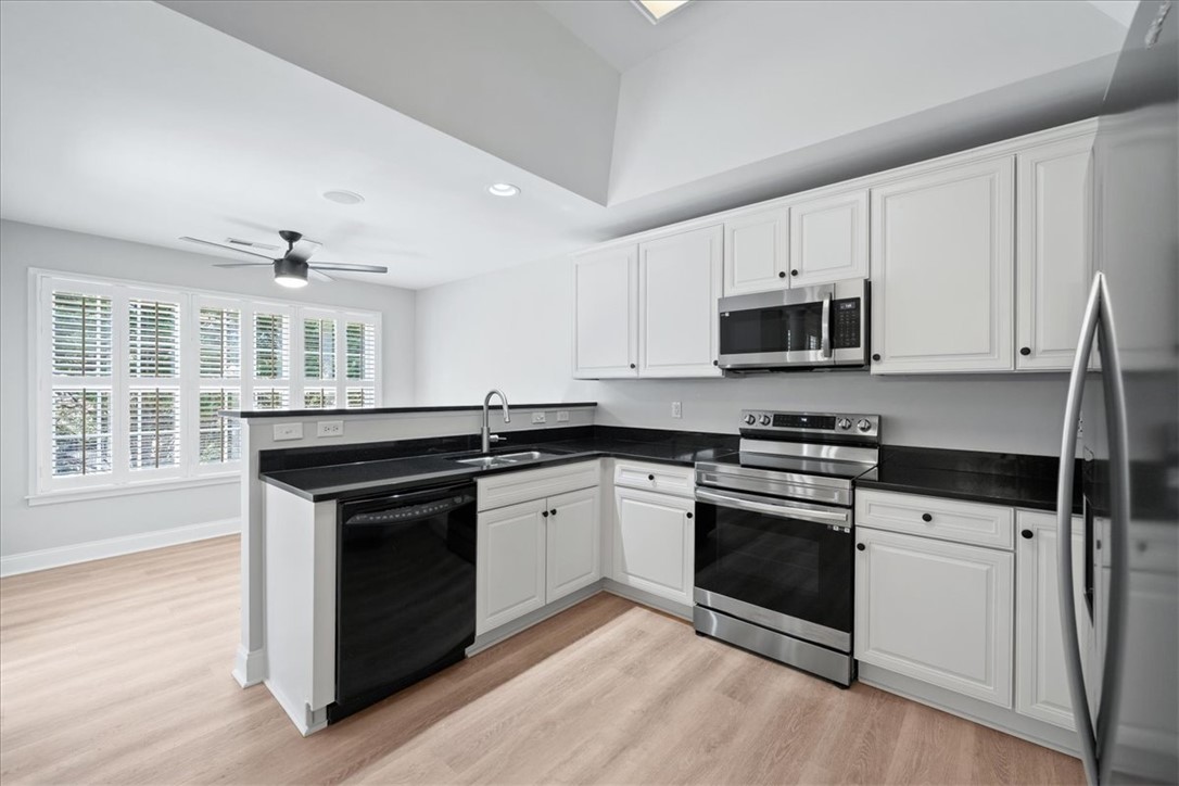 100 Shipyard Circle Anderson, SC 29621 - Photo 12 of 40 This modern kitchen features sleek countertops and appliances, perfect for everyday living.