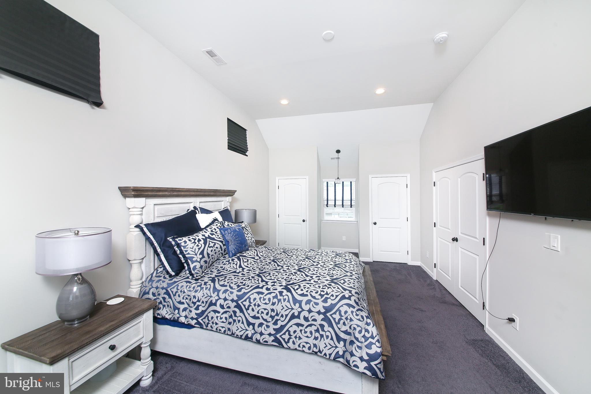 40 Greenbriar Road Levittown, PA 19057 - Photo 15 of 29 a bedroom with a bed and a flat screen tv