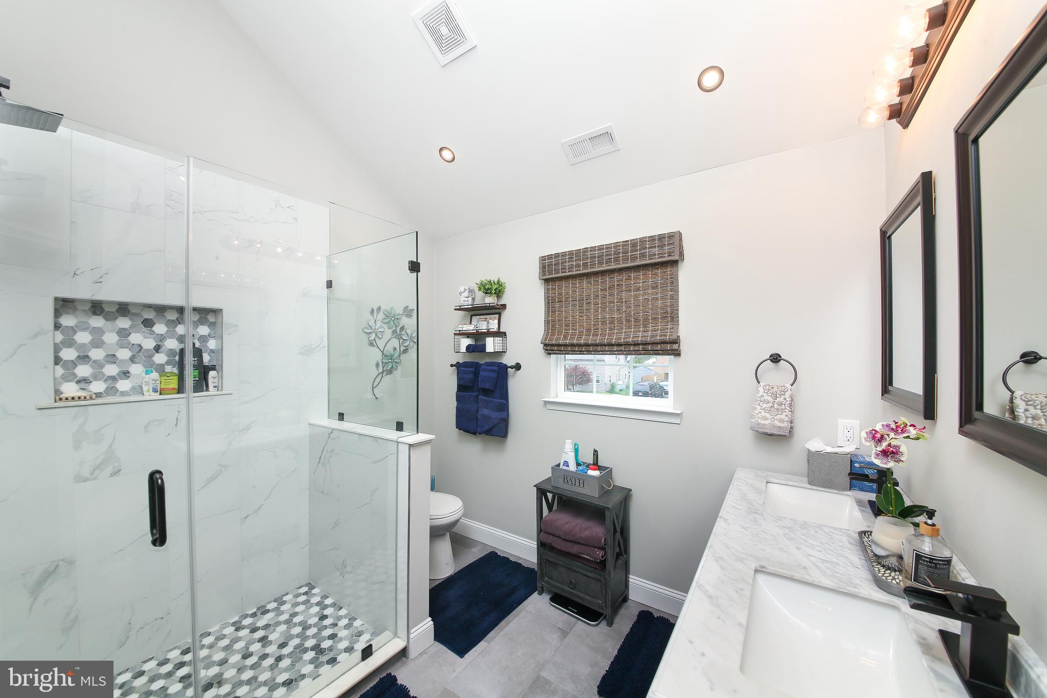 40 Greenbriar Road Levittown, PA 19057 - Photo 16 of 29 a bathroom with a sink toilet and shower