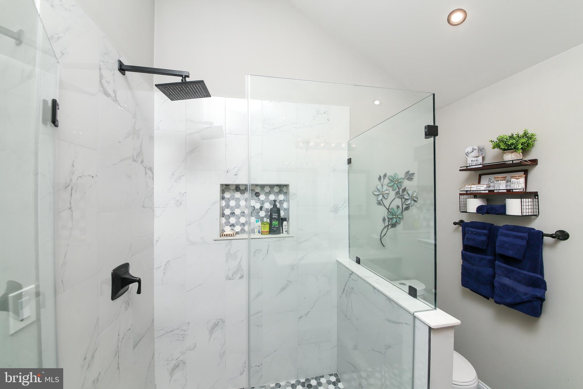 40 Greenbriar Road Levittown, PA 19057 - Photo 17 of 29 a bathroom with a bathtub and a shower