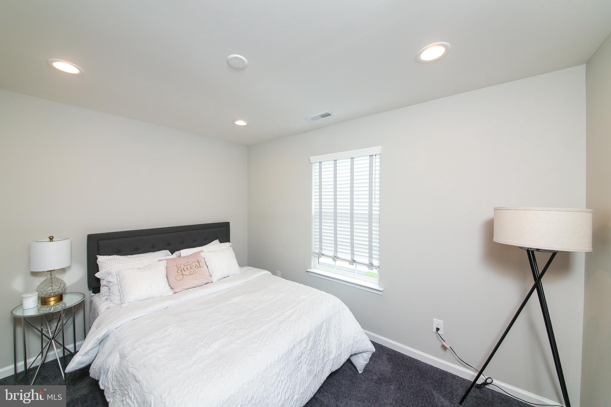 40 Greenbriar Road Levittown, PA 19057 - Photo 19 of 29 a bedroom with a bed and a window