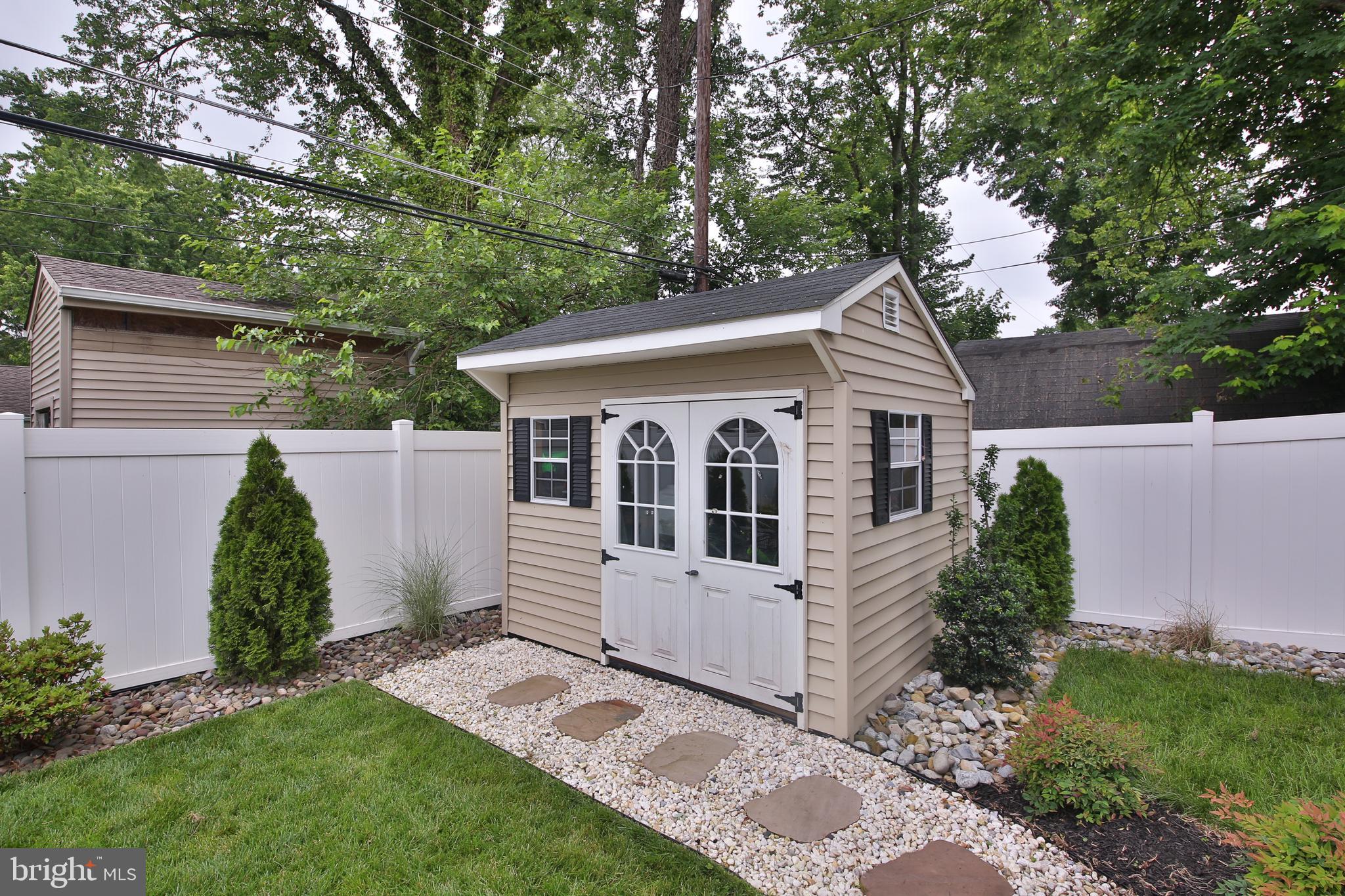 40 Greenbriar Road Levittown, PA 19057 - Photo 26 of 29 a view of a house with a yard and plants