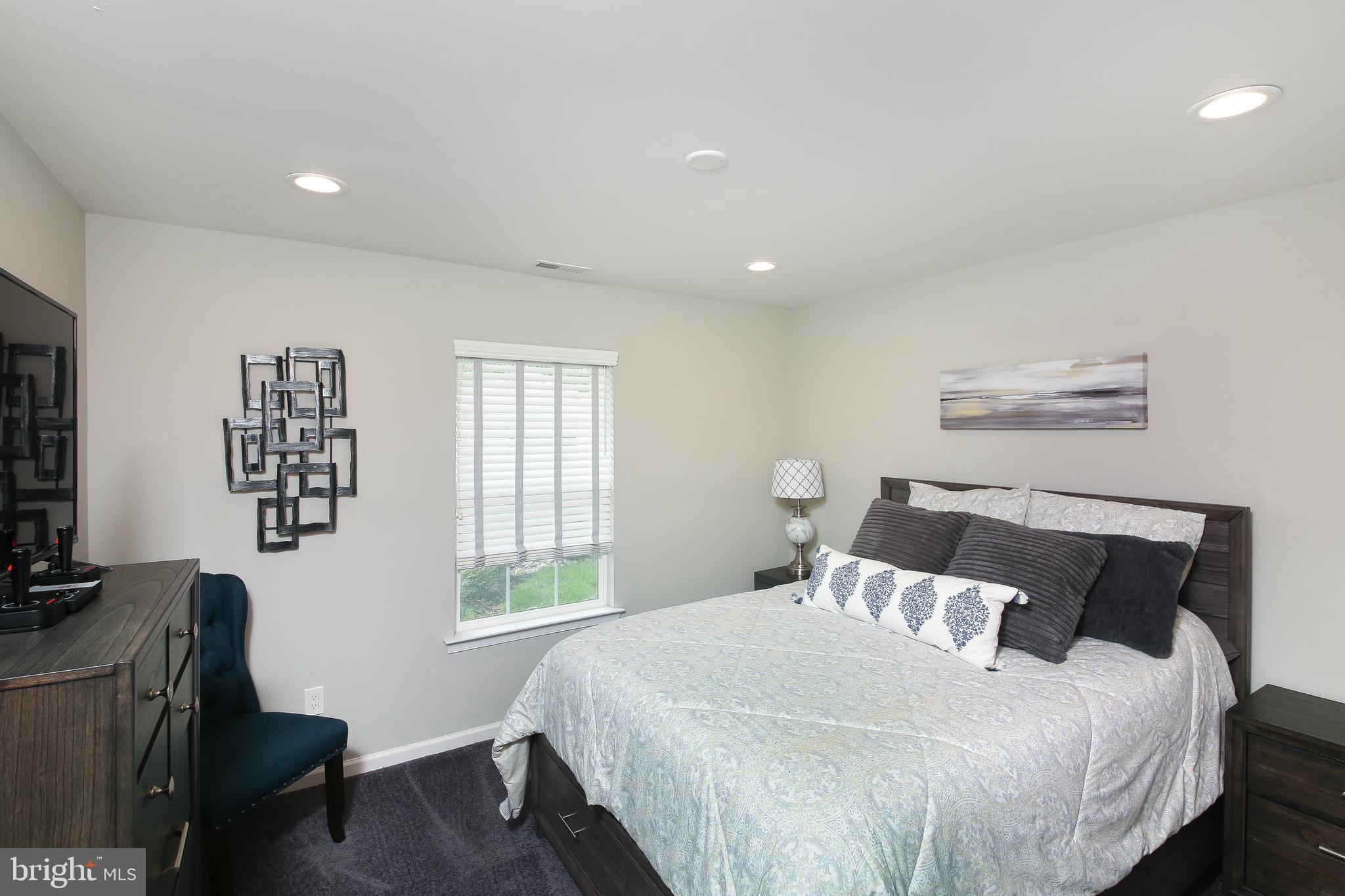 40 Greenbriar Road Levittown, PA 19057 - Photo 5 of 29 a bedroom with a bed window and a desk