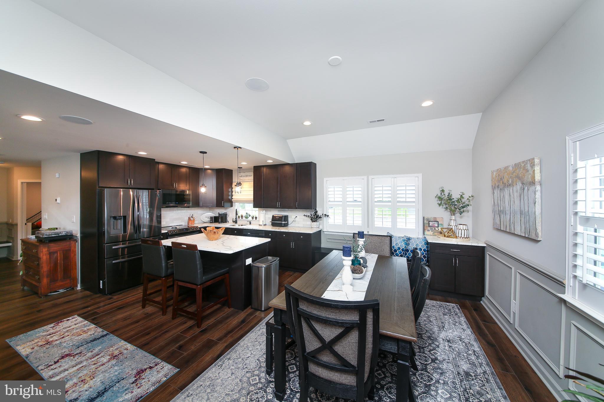 40 Greenbriar Road Levittown, PA 19057 - Photo 10 of 29 a room with a table chairs and a kitchen view