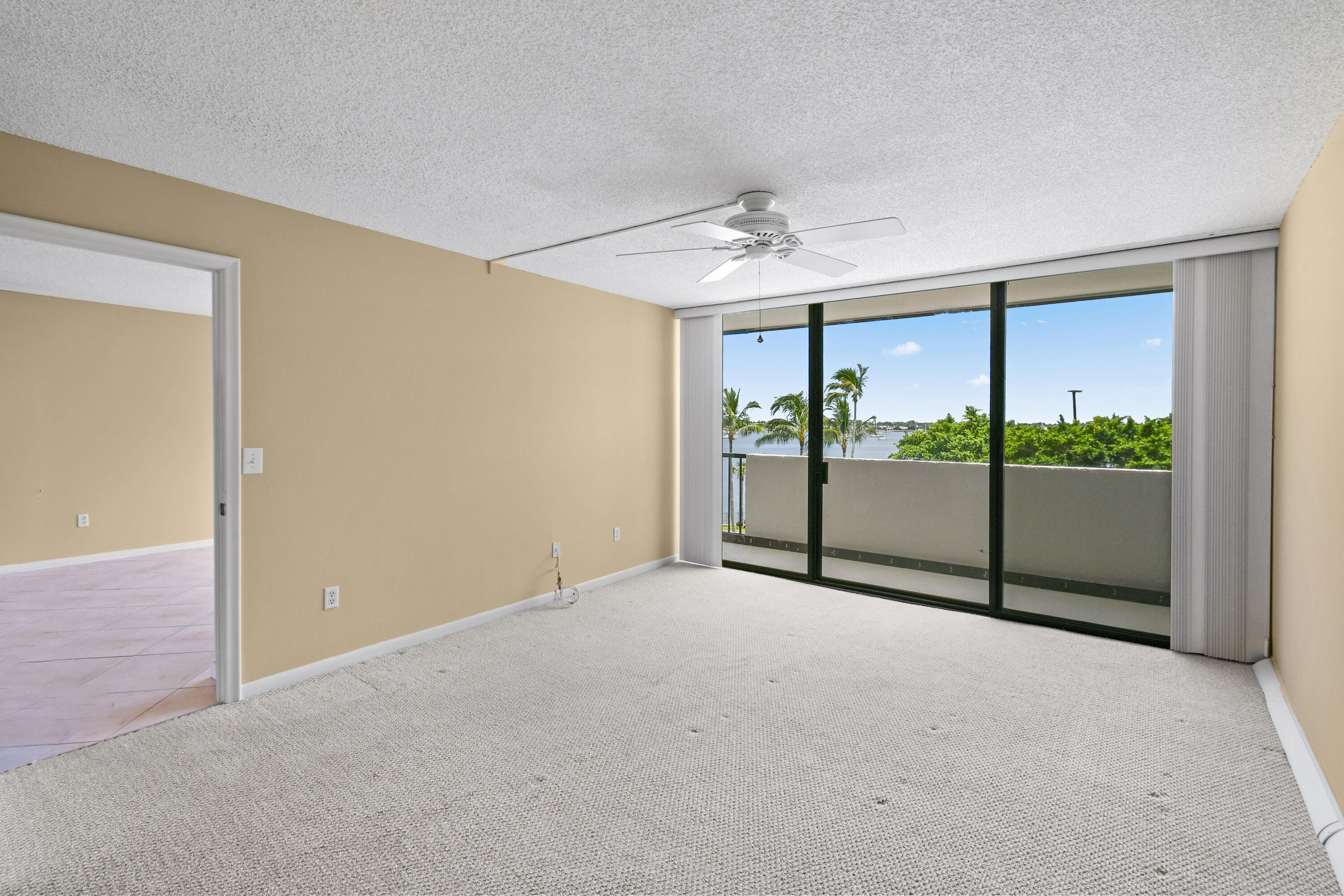 5200 North Flagler Drive, Unit 404 West Palm Beach, FL 33407 - Photo 13 of 33 a view of an empty room with a balcony