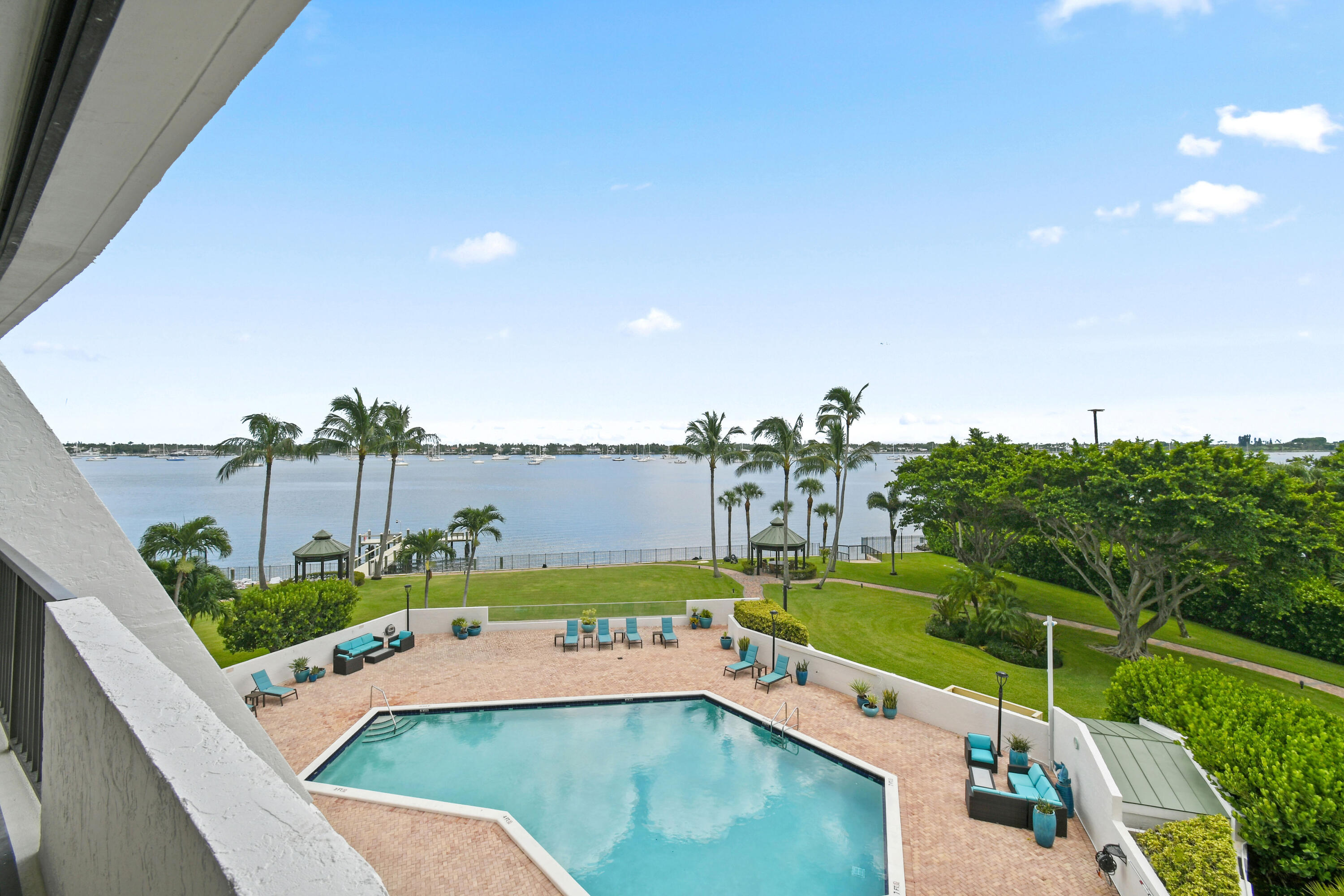 5200 North Flagler Drive, Unit 404 West Palm Beach, FL 33407 - Photo 23 of 33 a view of a swimming pool with a patio