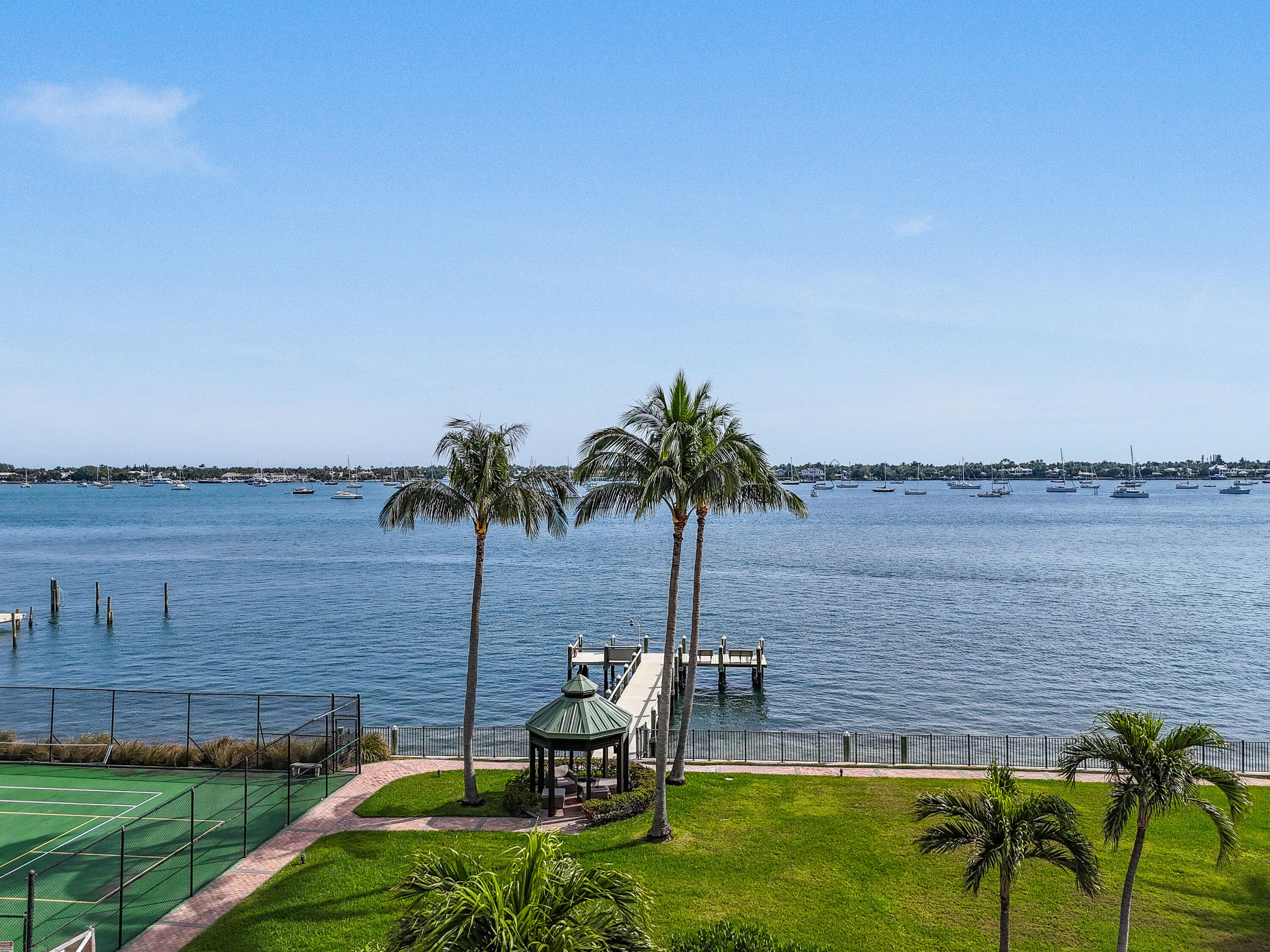 5200 North Flagler Drive, Unit 404 West Palm Beach, FL 33407 - Photo 25 of 33 a view of a lake with a yard