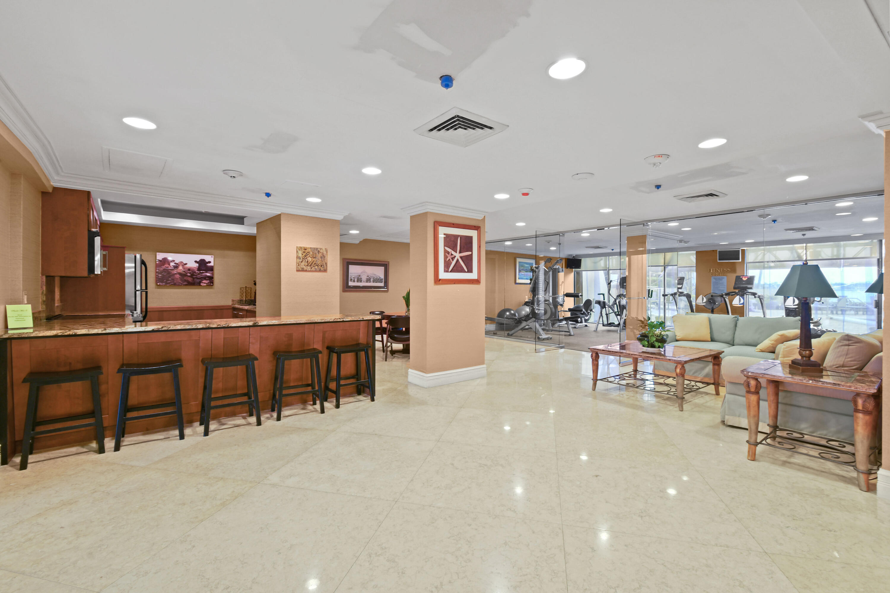 5200 North Flagler Drive, Unit 404 West Palm Beach, FL 33407 - Photo 31 of 33 a living room with lots of furniture and a table