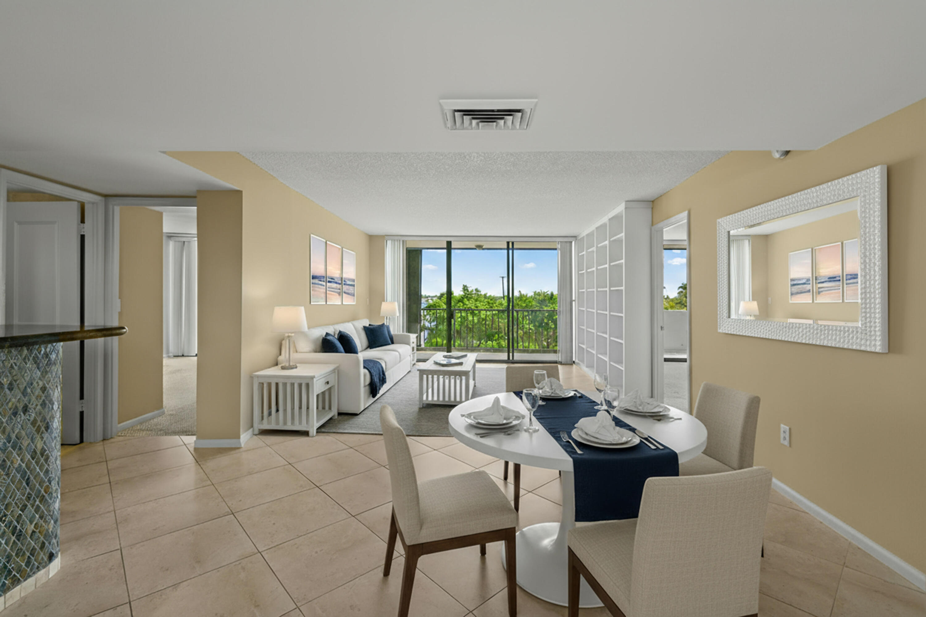 5200 North Flagler Drive, Unit 404 West Palm Beach, FL 33407 - Photo 4 of 33 a living room with furniture two window and a dining table
