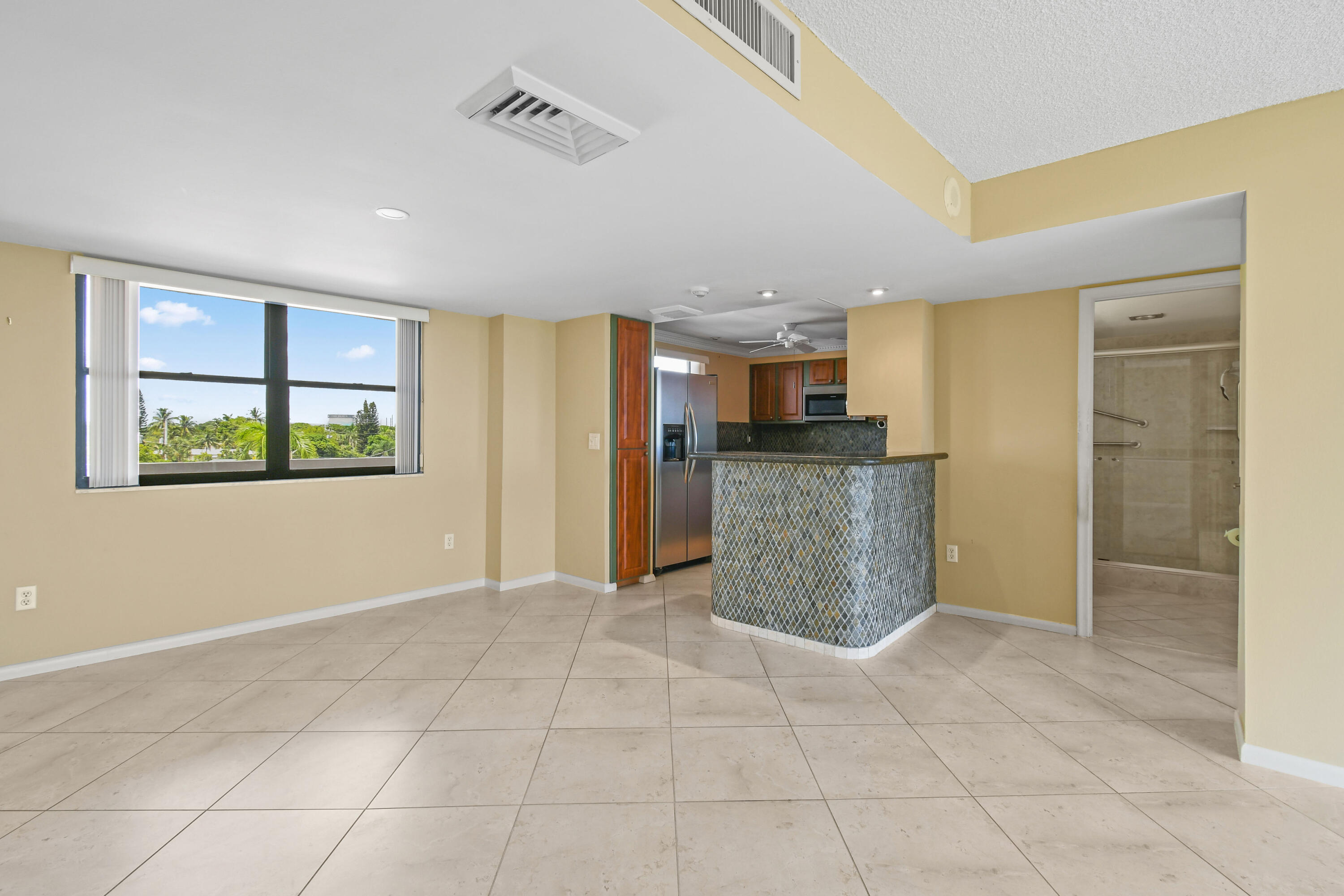 5200 North Flagler Drive, Unit 404 West Palm Beach, FL 33407 - Photo 8 of 33 a view of a kitchen with a sink