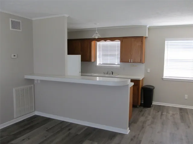 a bathroom with a sink and a window
