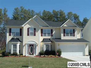 2423 Blueberry Ridge Road Matthews, NC 28105 - Photo 1 of 8 a front view of a house with a yard