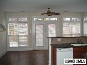 2423 Blueberry Ridge Road Matthews, NC 28105 - Photo 5 of 8 a kitchen with a chandelier and windows