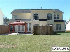 2423 Blueberry Ridge Road Matthews, NC 28105 - Photo 7 of 8 a front view of a house with a yard
