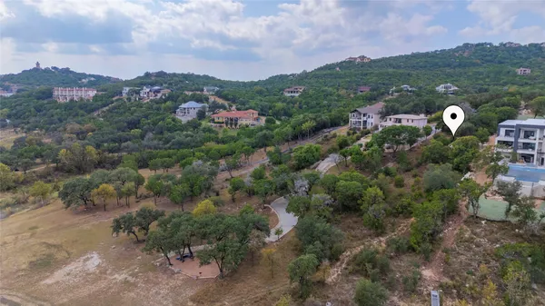 an aerial view of beach and residential houses with outdoor space