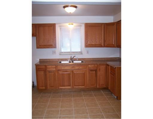 176 Poplar Ridge Road Penn Hills, PA 15235 - Photo 5 of 14 Kitchen. The kitchen features new oak cabinets, new counters, and ceramic tile floor.