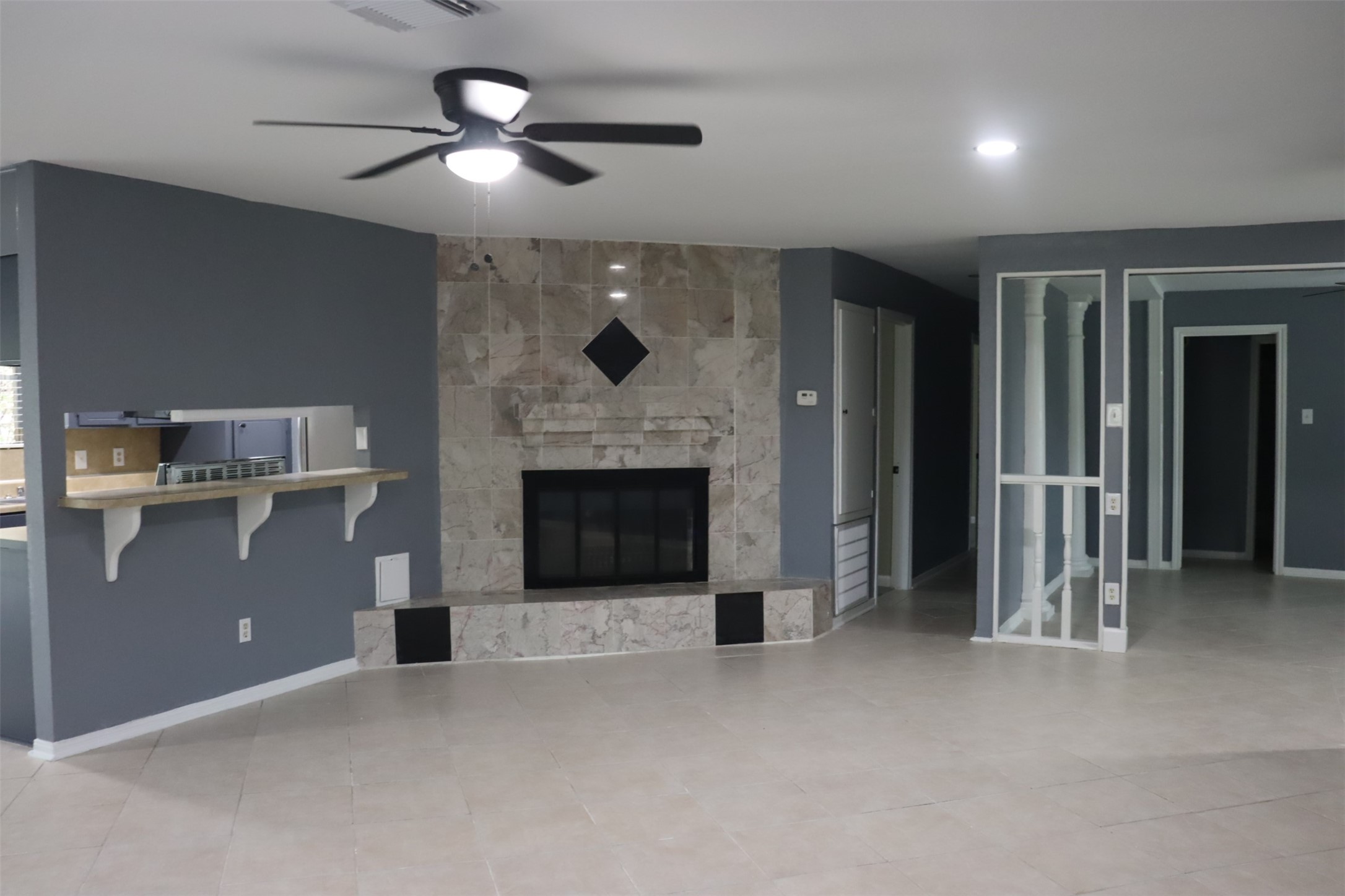12507 New Rochelle Court Houston, TX 77089 - Photo 4 of 12 an empty room with windows and fireplace