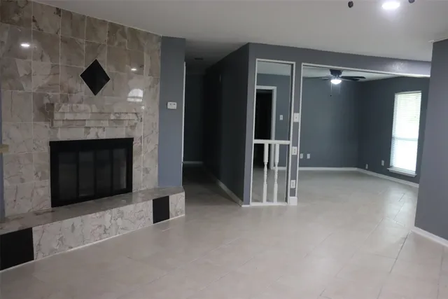 a view of livingroom with fireplace and window