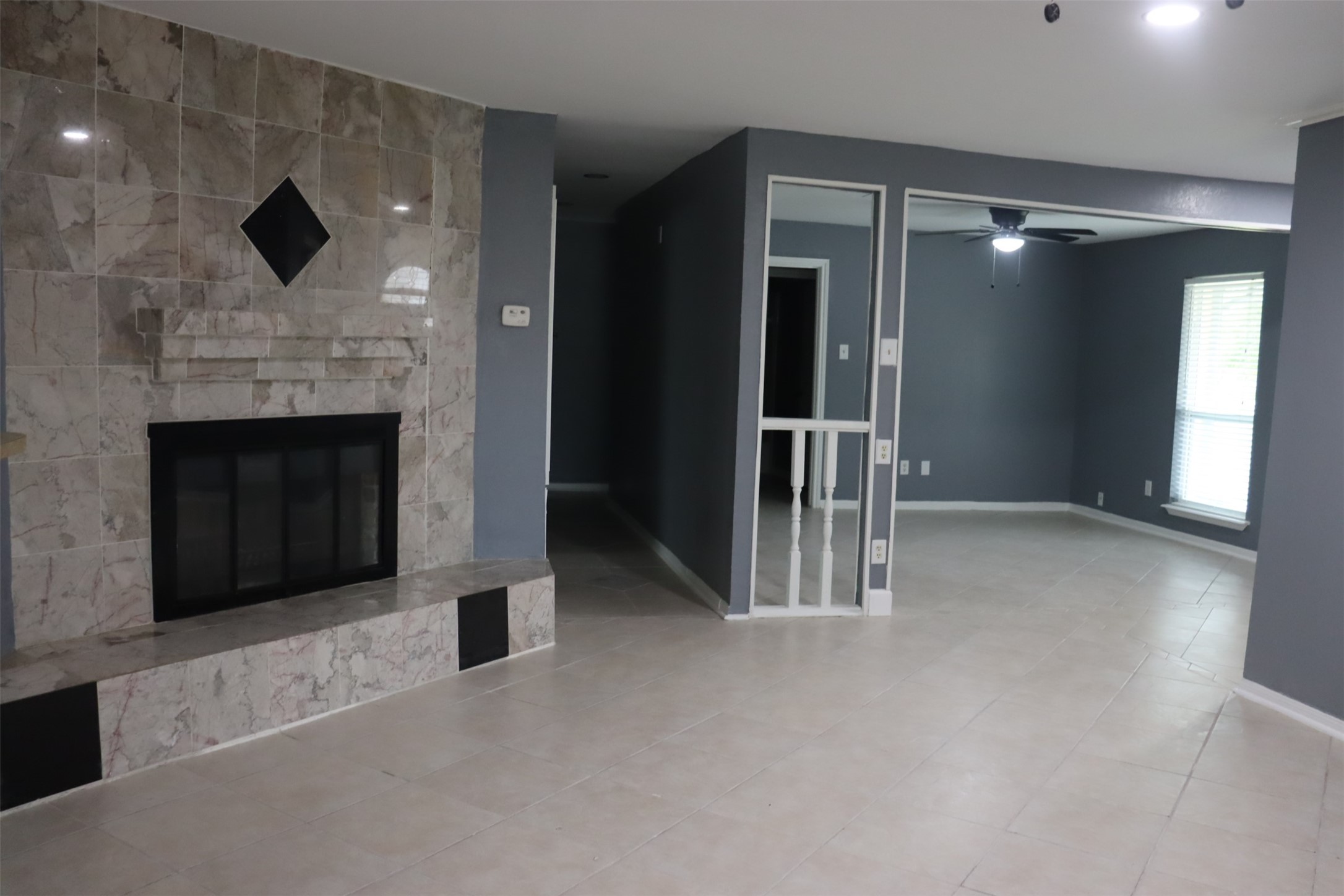 12507 New Rochelle Court Houston, TX 77089 - Photo 9 of 12 a view of livingroom with fireplace and window