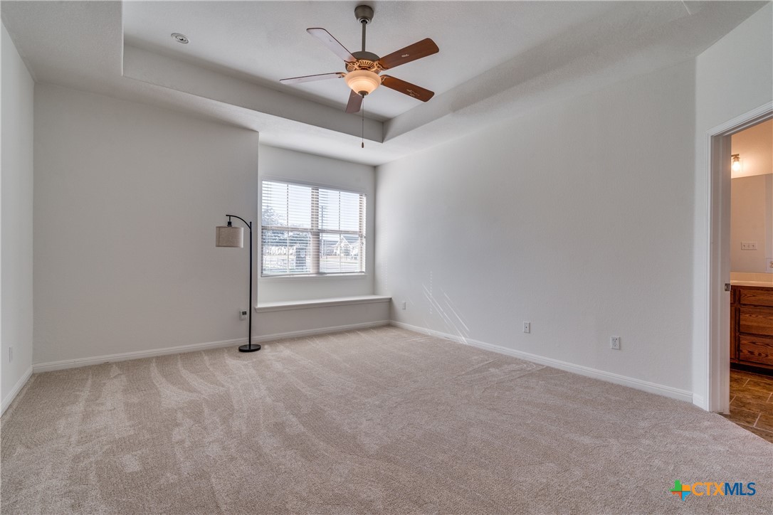 1019 Powell Kyle, TX 78640 - Photo 11 of 17 an empty room with windows and fan