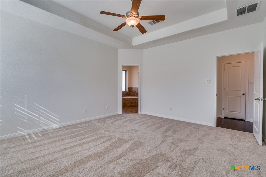 1019 Powell Kyle, TX 78640 - Photo 12 of 17 a view of empty room with ceiling fan