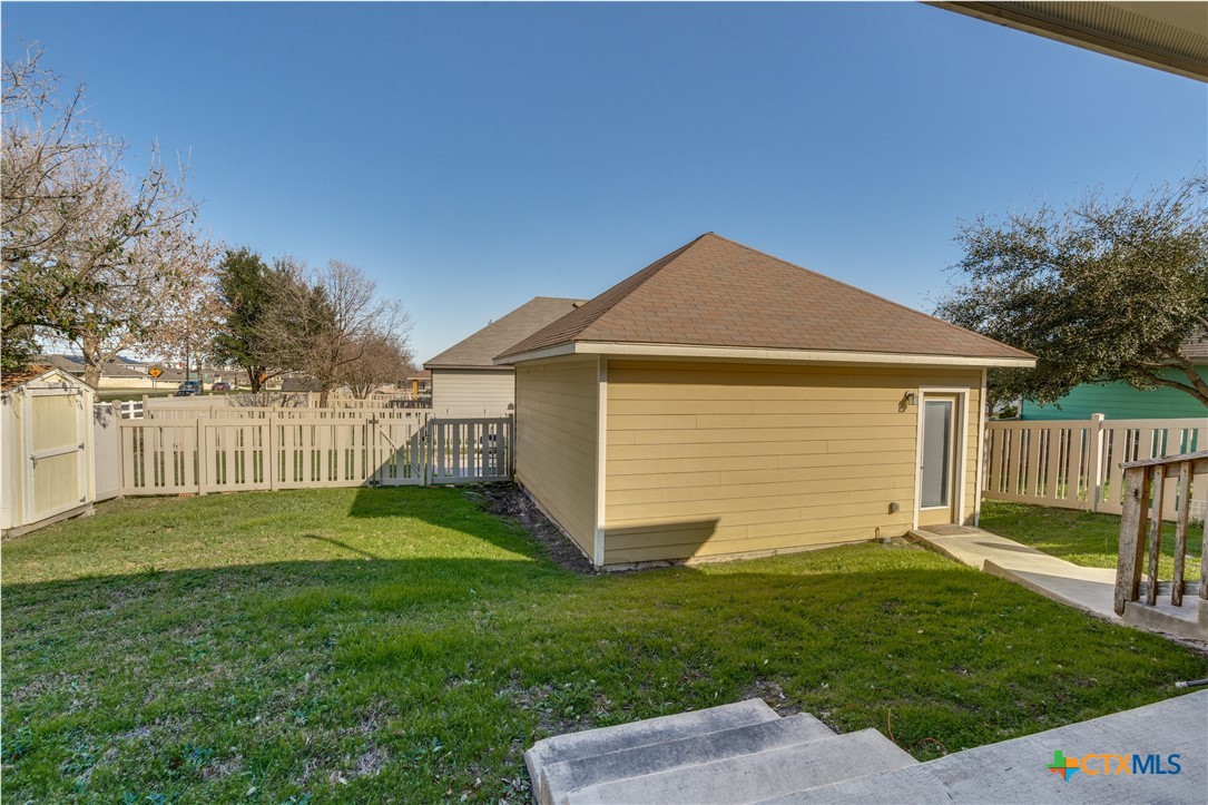1019 Powell Kyle, TX 78640 - Photo 16 of 17 a view of backyard of house with green space