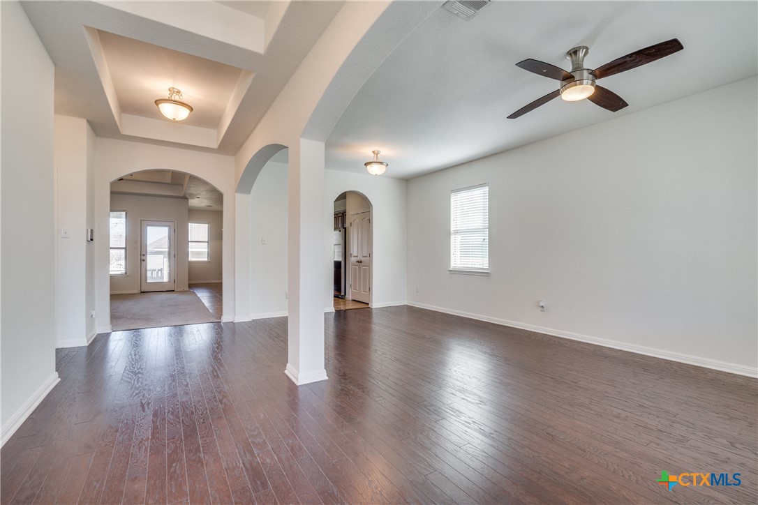 1019 Powell Kyle, TX 78640 - Photo 3 of 17 wooden floor in an empty room with a window