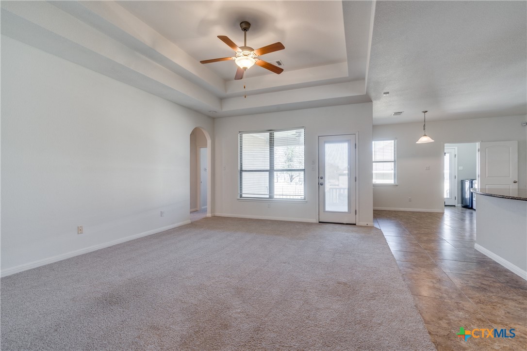 1019 Powell Kyle, TX 78640 - Photo 6 of 17 wooden floor in an empty room with a window