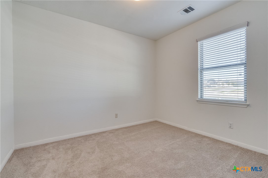 1019 Powell Kyle, TX 78640 - Photo 8 of 17 an empty room with a window